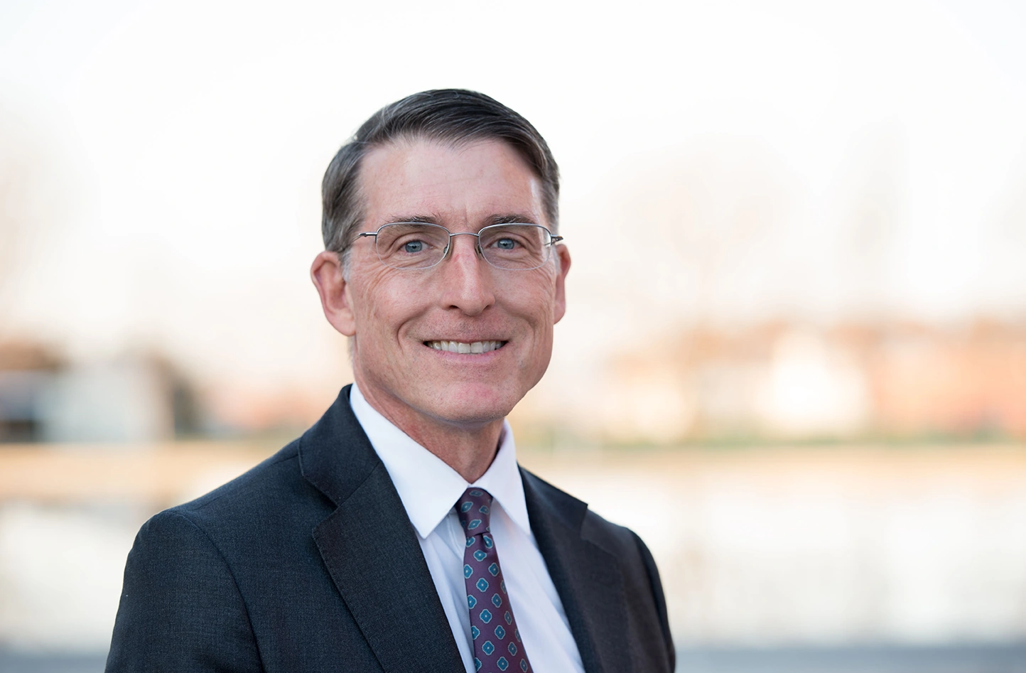 072125-jud-virden-phd-appointed-laboratory-director-at-nrel Portrait photo of a man in a suit and tie
