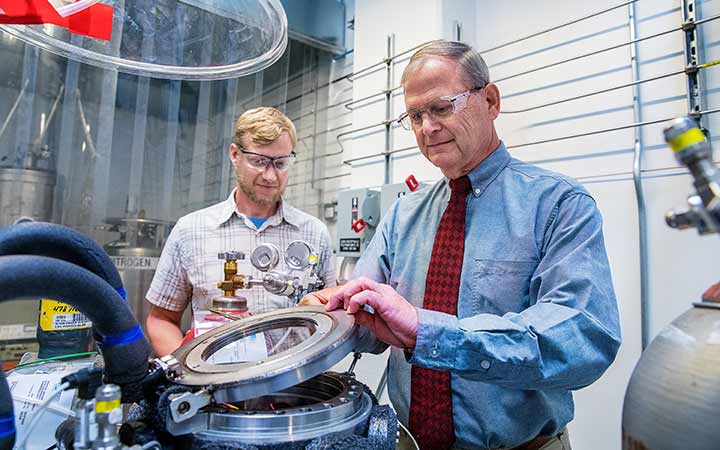 An engineer and a scientist work in the Sensor Lab.
